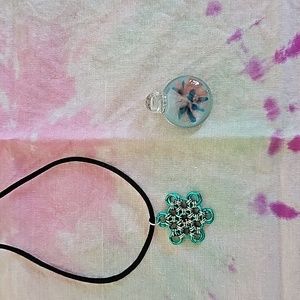 Two handmade necklaces pendants.
